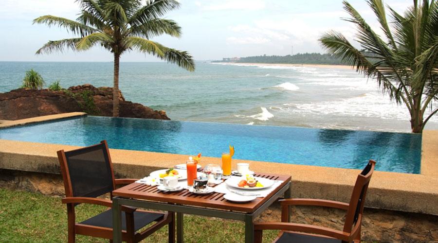 dining table by the private villa pool