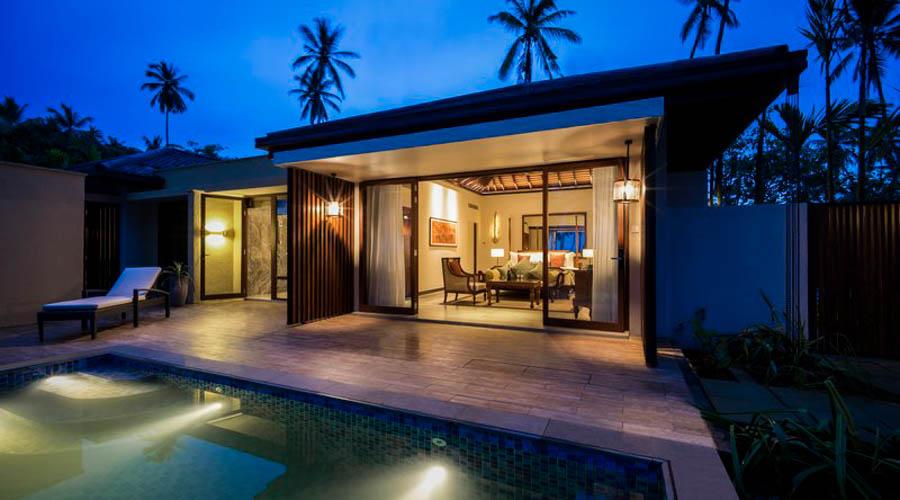 beach pool villa exterior at dusk