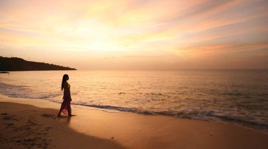 Woman walking on beach